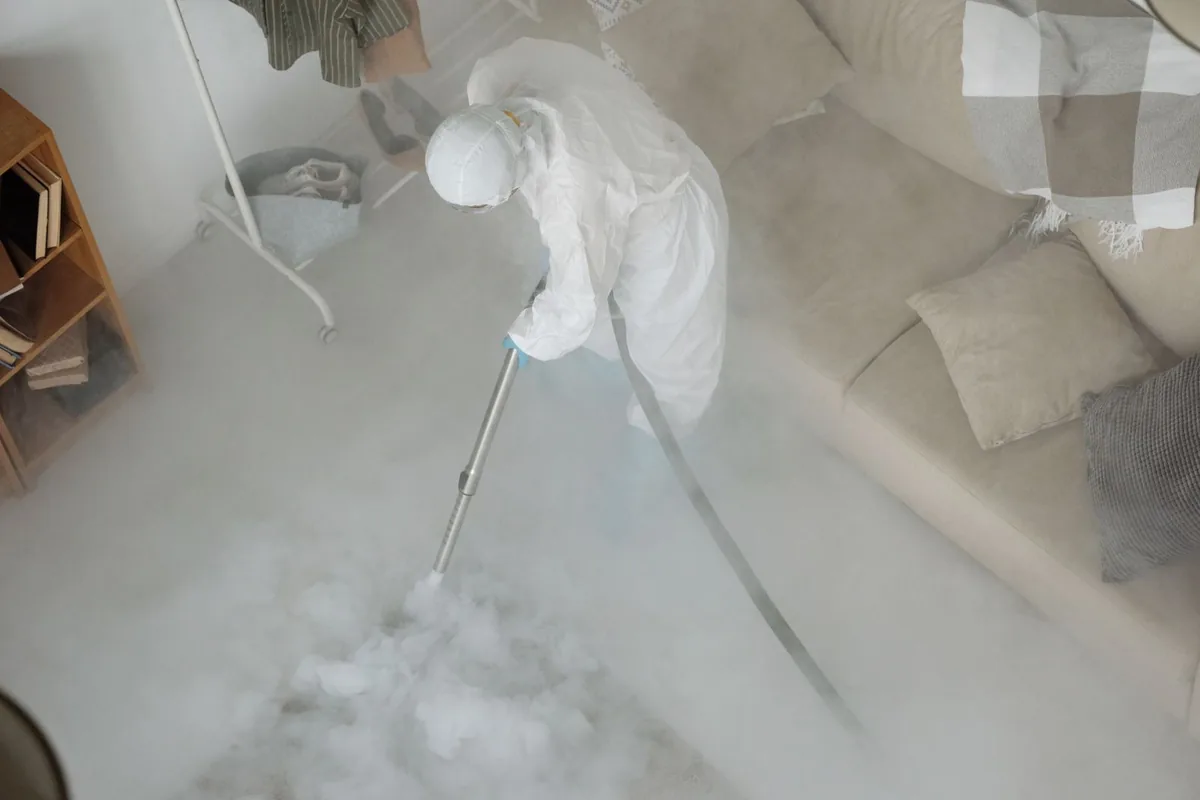 Biohazard cleanup technician in protective equipment, Seneca, PA